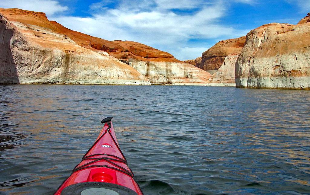 The bow of the kayak on the Colorado River passing through Glen Canyon, in the zone of Lake Powell (the USA).