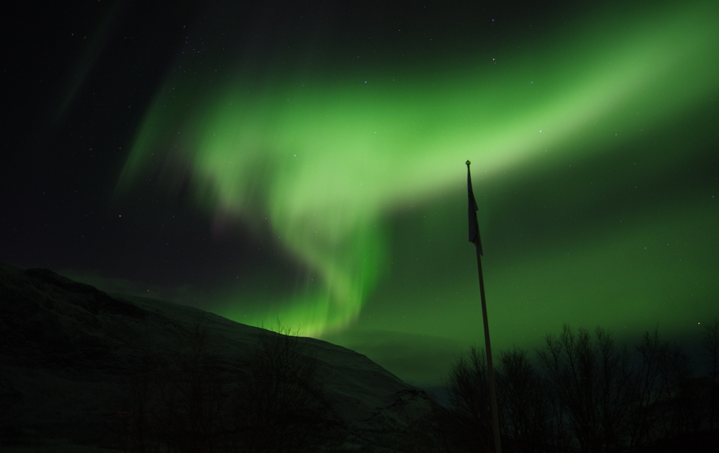 Green lights in an aurora borealis in the Norrbotten sky, Sweden.